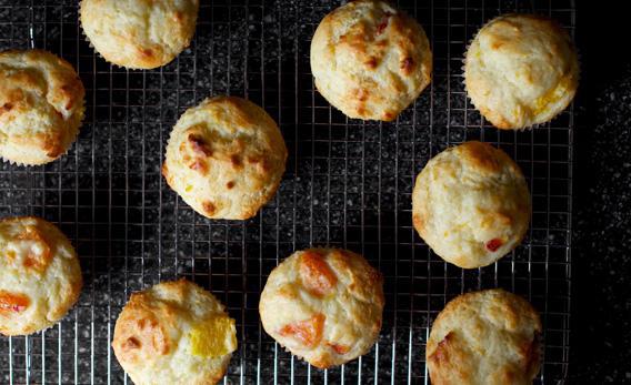 Orange muffins baked and cooling.