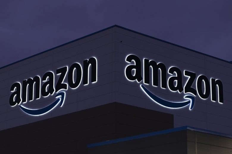 LONDON, ENGLAND - DECEMBER 13: A general view of the Amazon sign at the Amazon fulfilment centre on December 13, 2021 in London, England. In September, the e-commerce giant announced it would seek to fill 20,000 seasonal positions this year across the United Kingdom, bolstering its workforce in fulfilment centres, sort centres and delivery stations amid peak trading times, including Christmas. (Photo by Dan Kitwood/Getty Images,)
