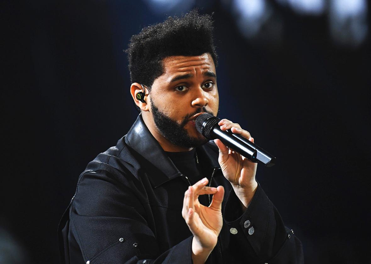 Weeknd performs during the runway at the Victoria's Secret Fashion Show on November 30, 2016 in Paris, France.  