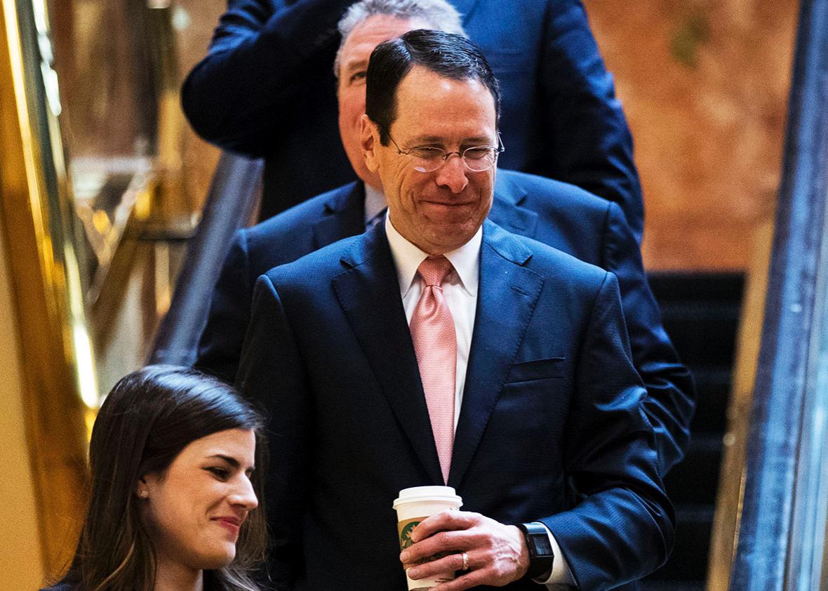 AT&T Chief Executive Officer Randall Stephenson takes an escaltor down to the lobby at Trump Tower, January 12, 2017 in New York City.
