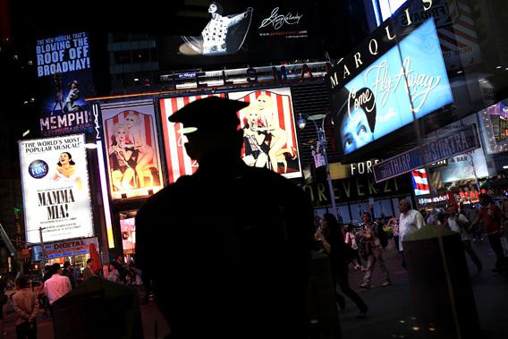 A New York City police officer pictured stands watch in Times Square.