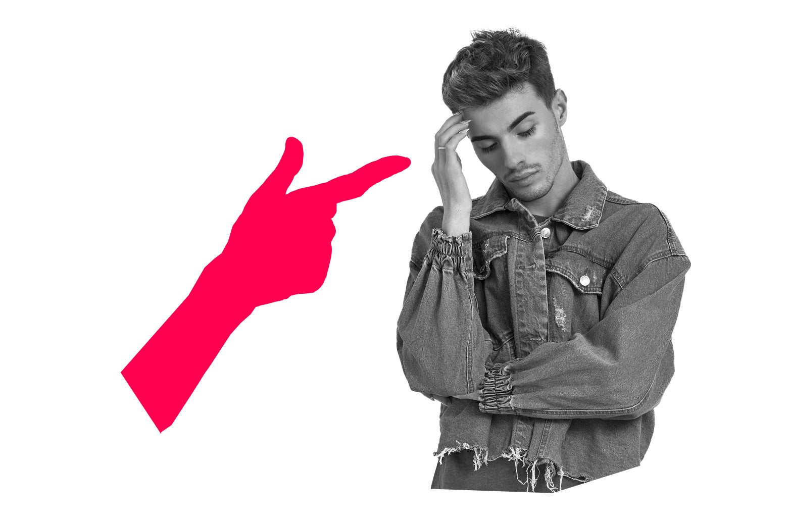 Man in a jean jacket brushing his hair with a hand pointing at him.