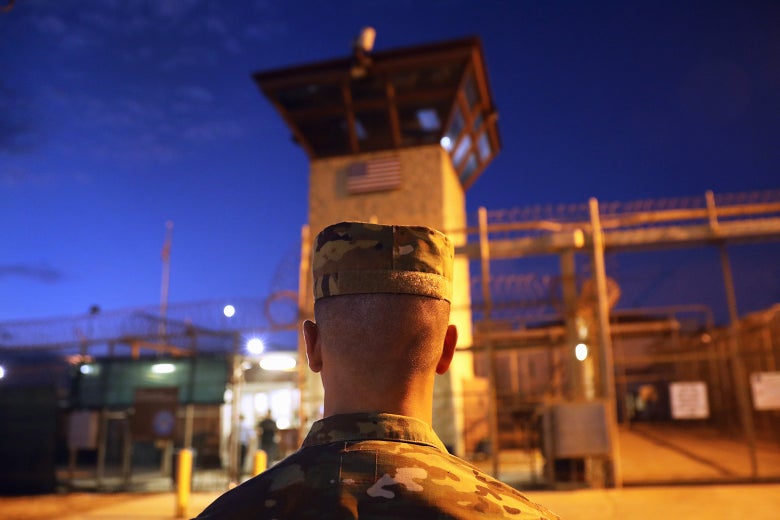 A U.S. Army soldier stands outside the entrance of the detention center at the U.S. Naval Station at Guantanamo Bay, Cuba, on Oct. 22, 2016.