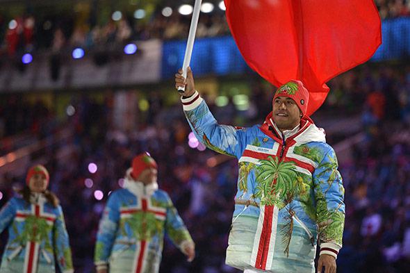 Tonga's flag bearer, luger Bruno Banani leads his national delegation during the Opening Ceremony of the Sochi Winter Olympics at the Fisht Olympic Stadium on February 7, 2014 in Sochi. 