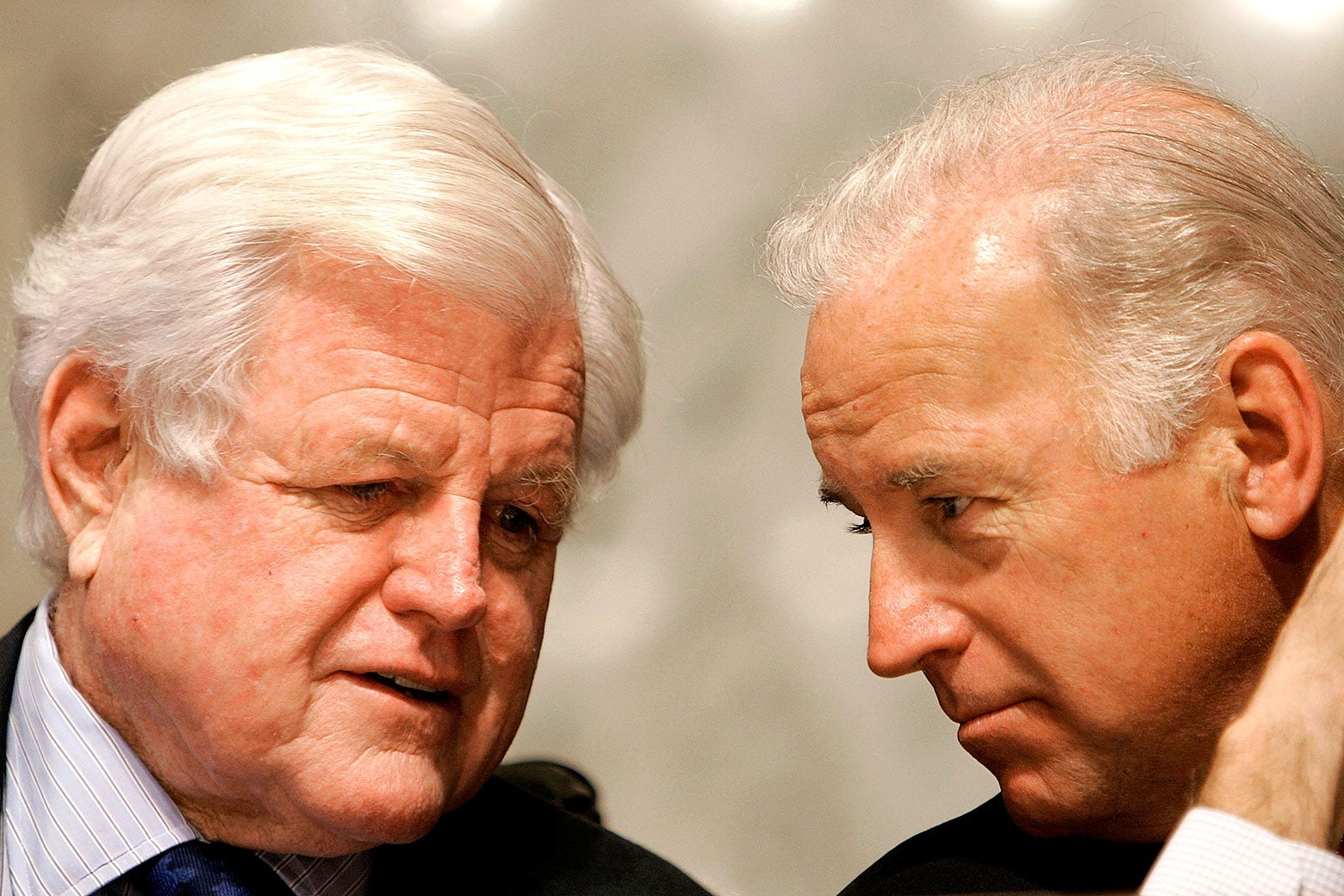 Kennedy speaks to Biden, who is leaning in