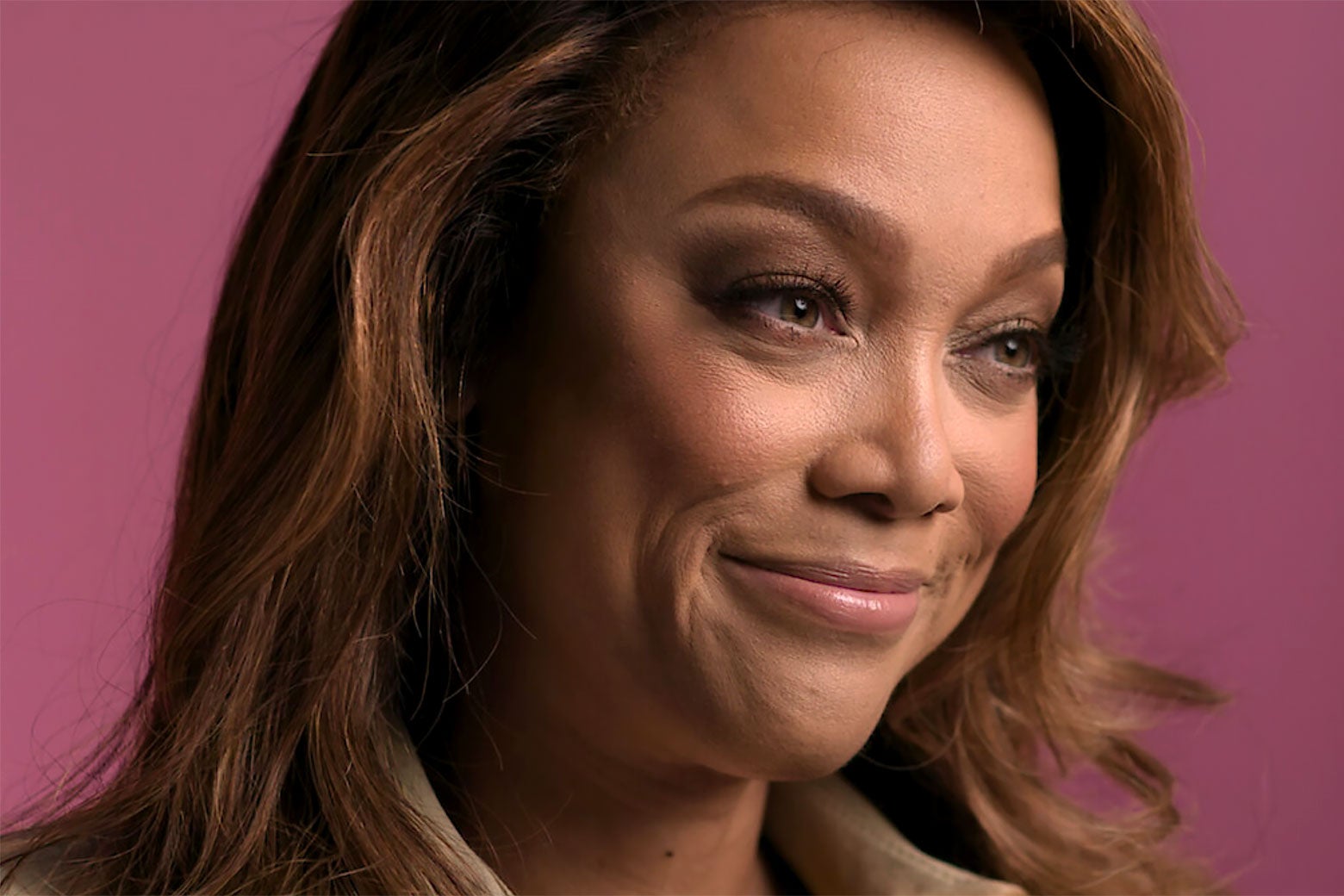 Tyra Banks smiles kind of woefully in a still from the documentary. 
