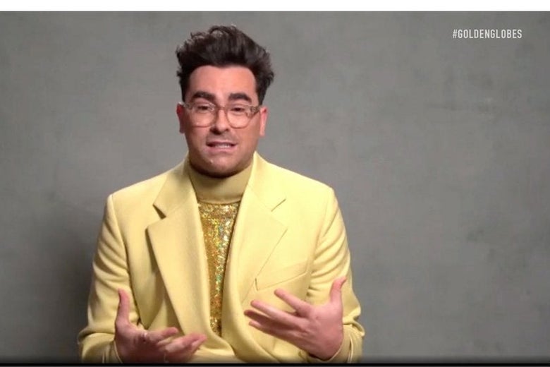 Dan Levy accepts an award via Zoom.