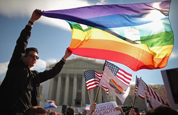 Eric Breese (L) of Rochester, New York, joins fellow George Washington University students and hundreds of others to rally outside the Supreme Court during oral arguments in the second of two cases the Court is hearing about same-sex marriage on March 27, 2013 in Washington, DC.