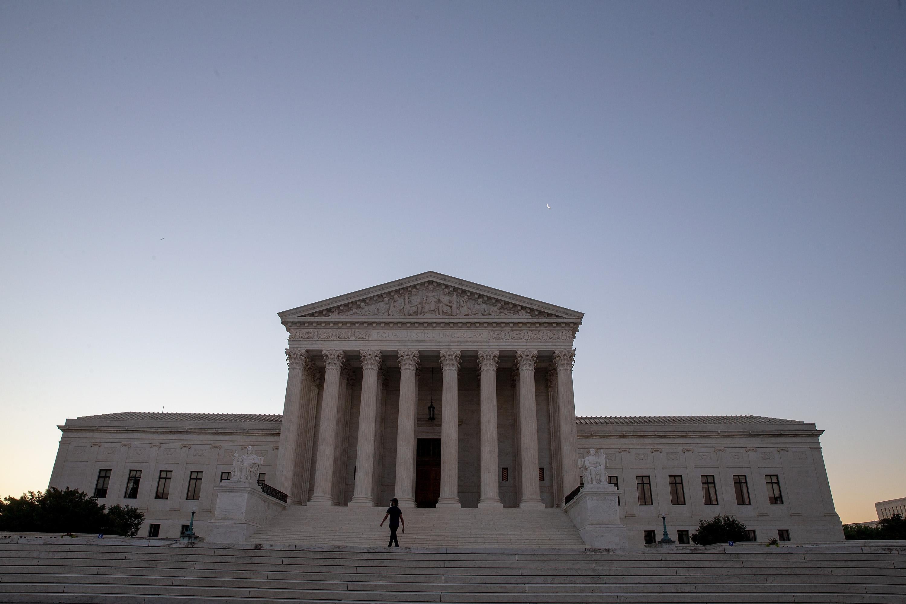 The Supreme Court building at sunrise.