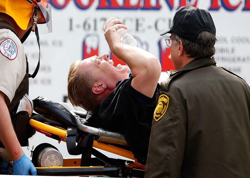 A man is loaded into an ambulance after he was injured by one of two bombs exploded during the 117th Boston Marathon near Copley Square on April 15, 2013 in Boston, Massachusetts. 