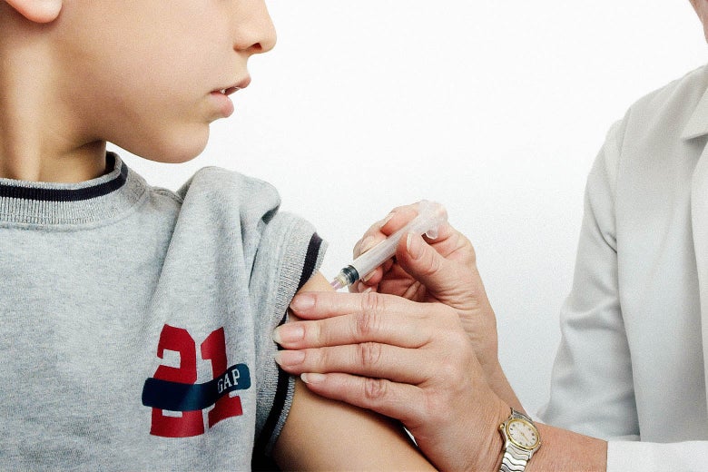 A kid in a T-shirt receives a vaccine.