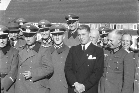 Von Braun standing with a bunch of Nazis in uniform