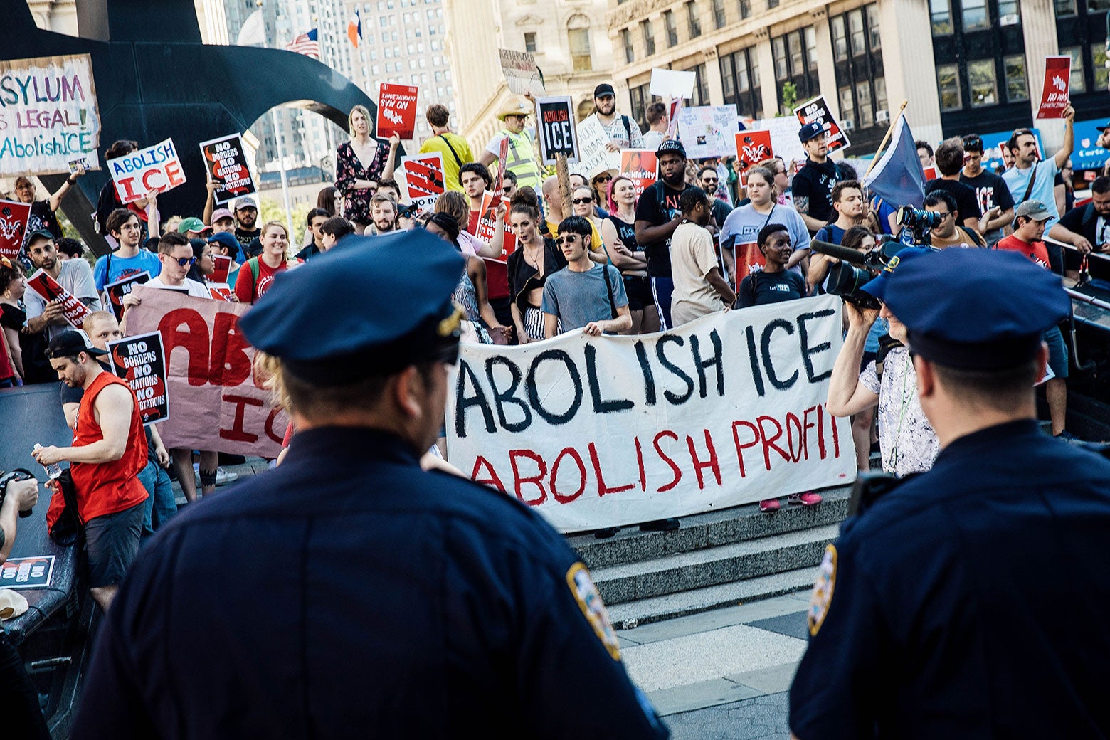 Activists march and rally against Immigration and Customs Enforcement  across the street from the ICE offices at Federal Plaza in New York on June 29.