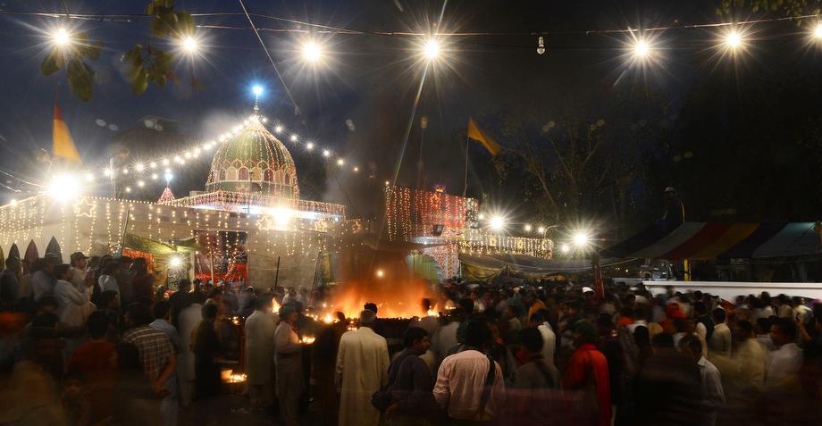 Pakistani devotees gather at the shrine of Sufi saint Hazrat Shah Hussain, popularly known as Madhu Lal Hussain, on March 30, 2013 in Lahore.