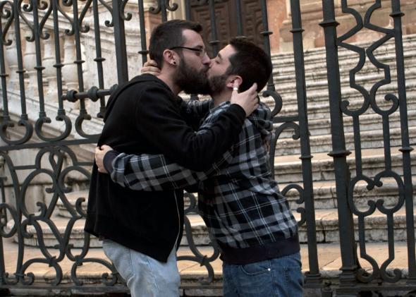 Two men kiss in Malaga, Spain.