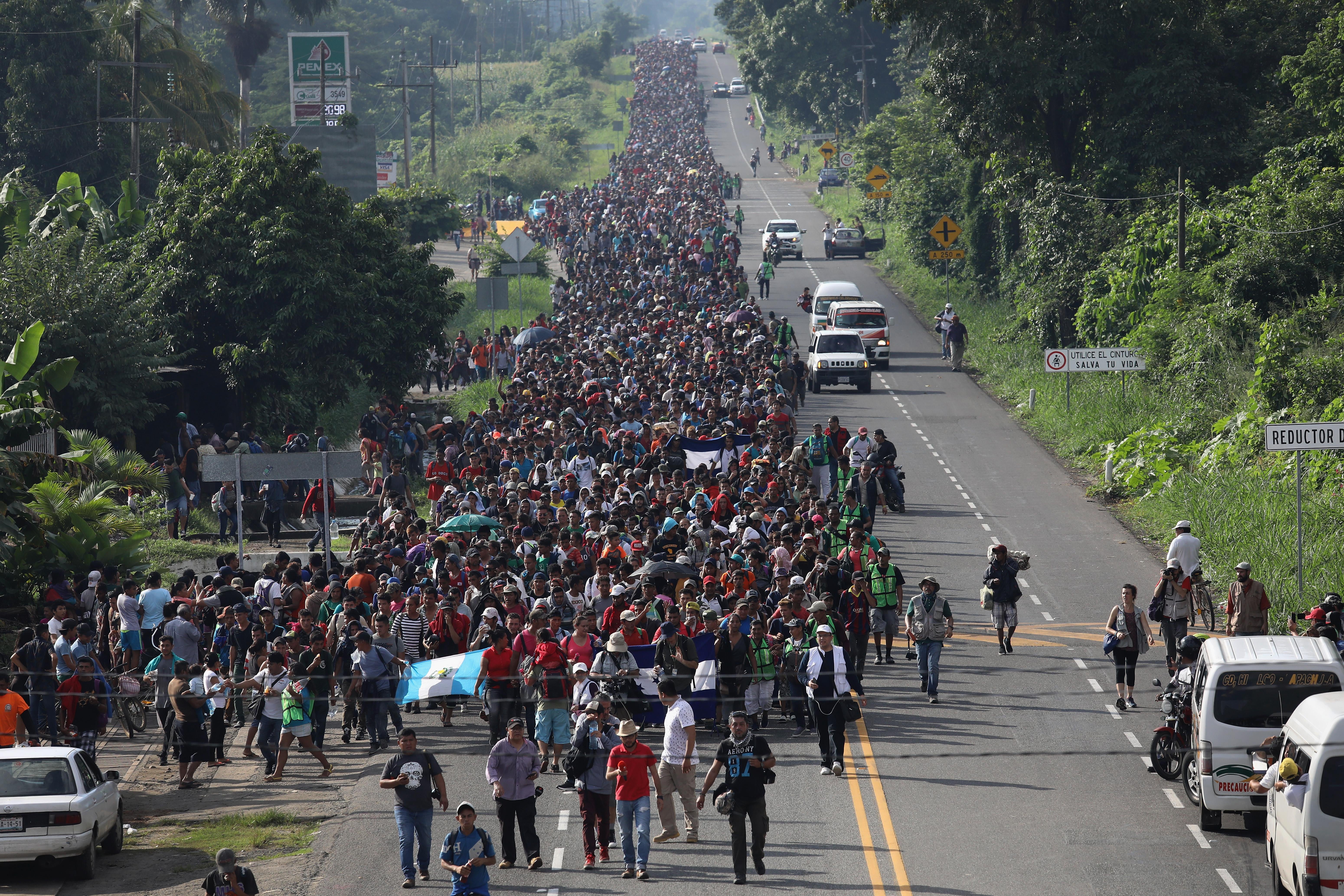 A migrant caravan, which has grown into the thousands, walks into the interior of Mexico after crossing the Guatemalan border on October 21, 2018 near Ciudad Hidalgo, Mexico.