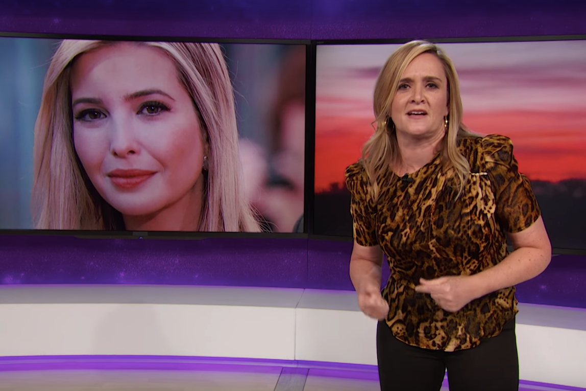 Samantha Bee stands in front of a graphic of Ivanka Trump's face