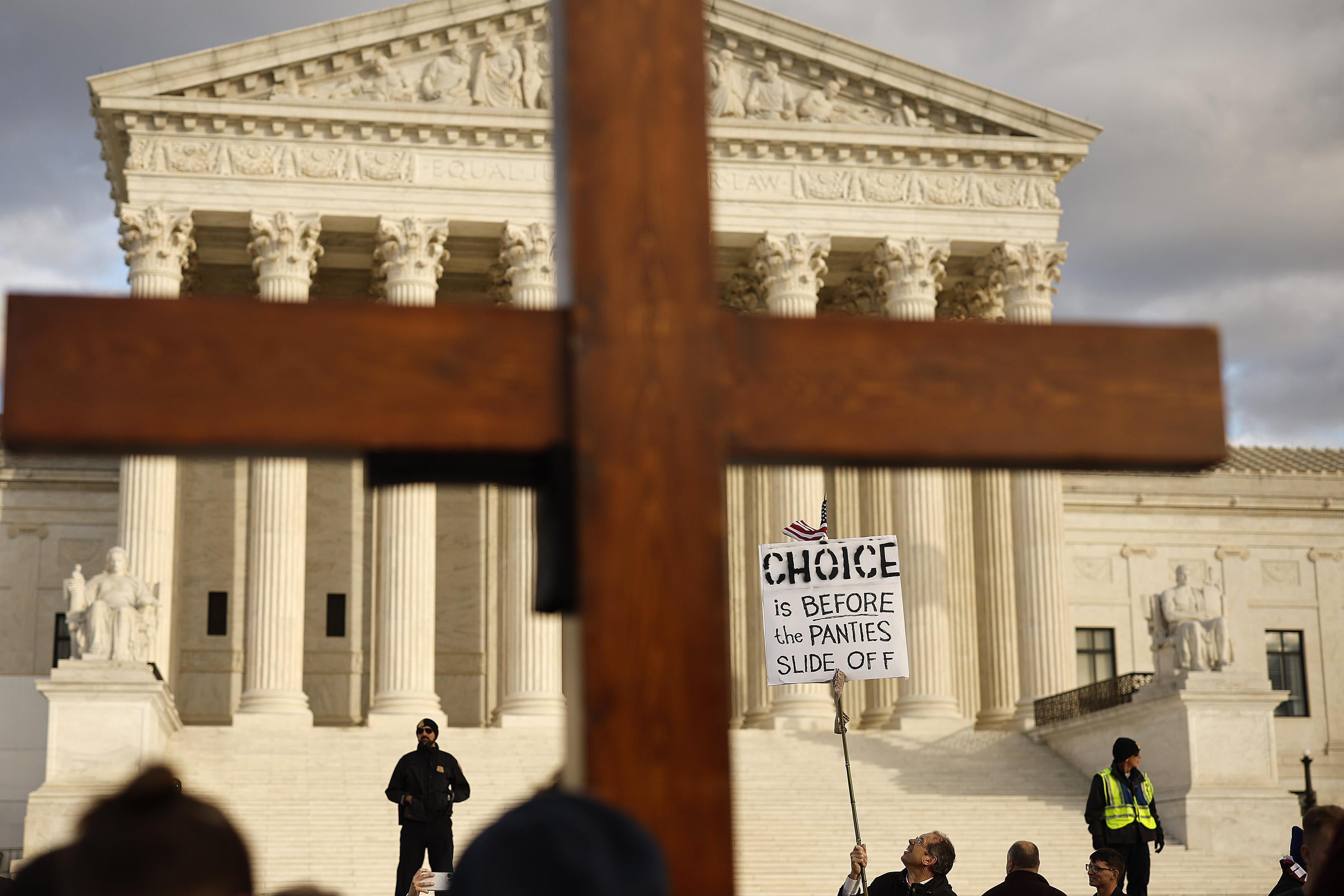 A photo of the March for Life in Washington D.C.—the image shows a cross over the Supreme Court.