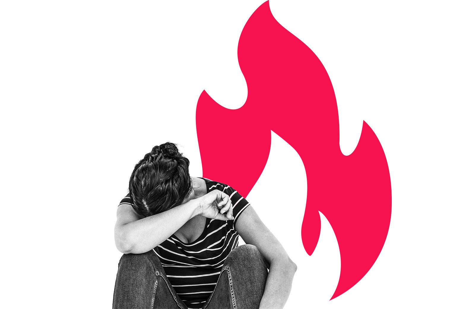 A woman sits with her head in her arm in front of an illustration of a flame.
