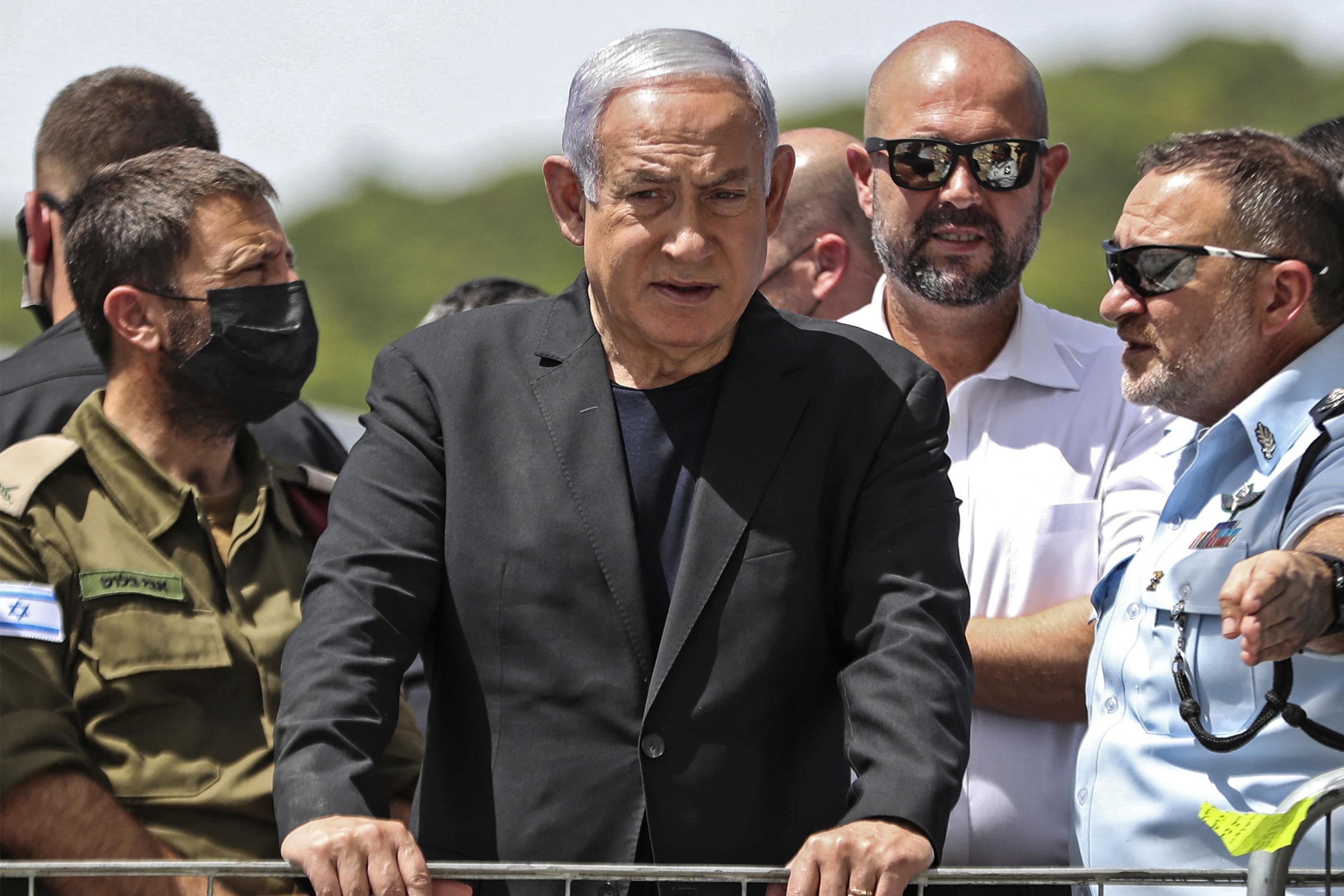 Israeli Prime Minister Benjamin Netanyahu visits the site of an overnight stampede during an ultra-Orthodox religious gathering in the northern Israeli town of Meron, on April 30, 2021. - The massive stampede at the densely-packed site near the reputed tomb of Rabbi Shimon Bar Yochai, a second-century Talmudic sage, where mainly ultra-Orthodox Jews flock to mark the Lag BaOmer holiday, killed at least 44 people in northern Israel, blackening the country's largest COVID-era gathering. (Photo by Ronen ZVULUN / POOL / AFP) (Photo by RONEN ZVULUN/POOL/AFP via Getty Images)