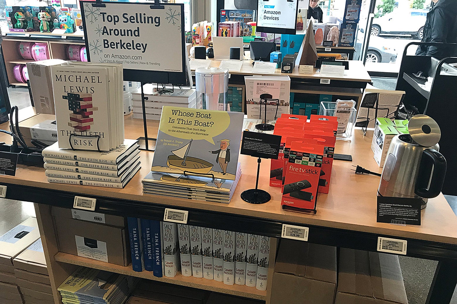 A sign says "Top Selling Around Berkeley" over books by Michael Lewis, a Fire TV Stick, and other items.