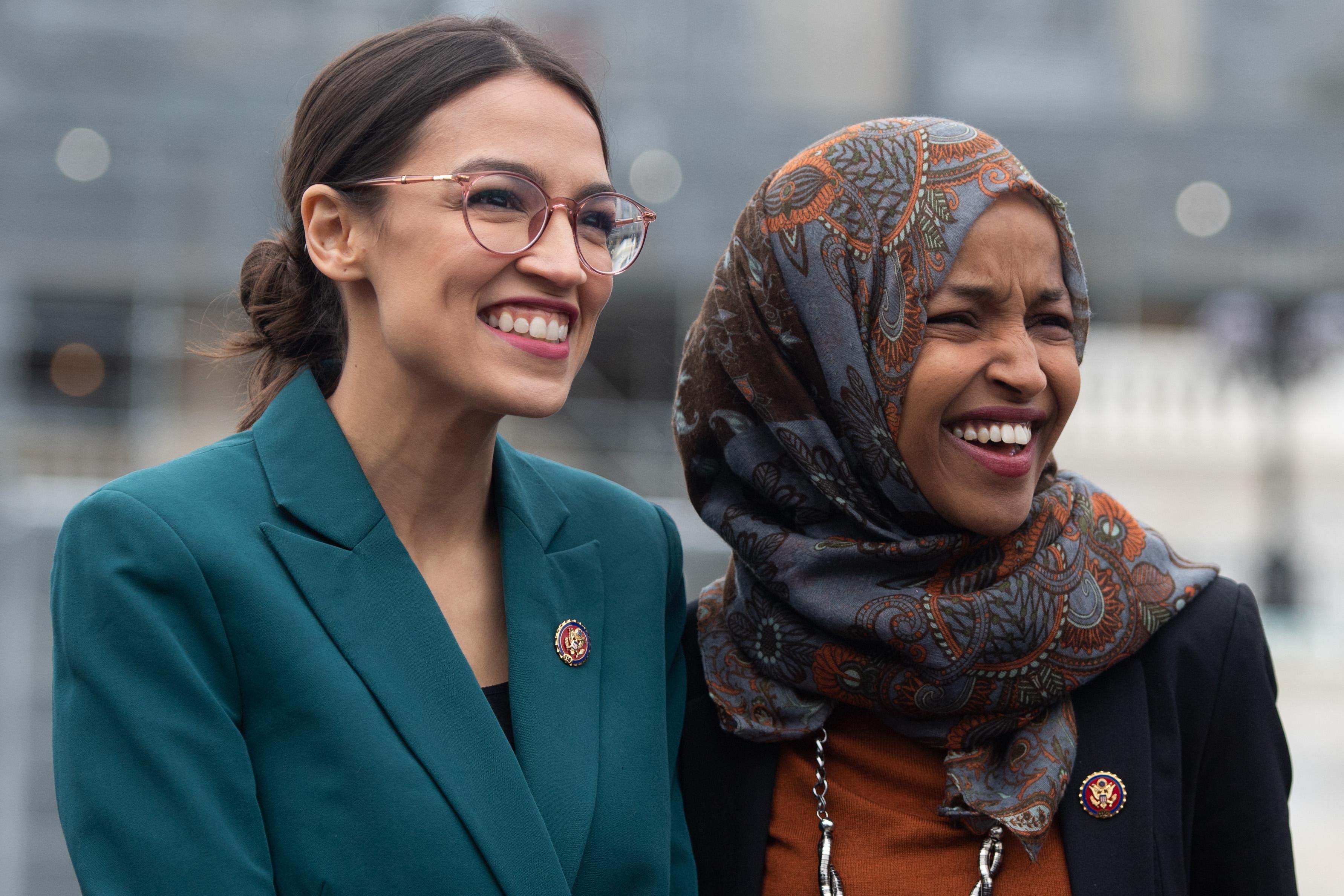 Rep.e Alexandria Ocasio-Cortez, Democrat of New York, and Rep. Ilhan Omar (R), Democrat of Minnesota, attend a press conference outside the Capitol in Washington, D.C. on February 7, 2019.