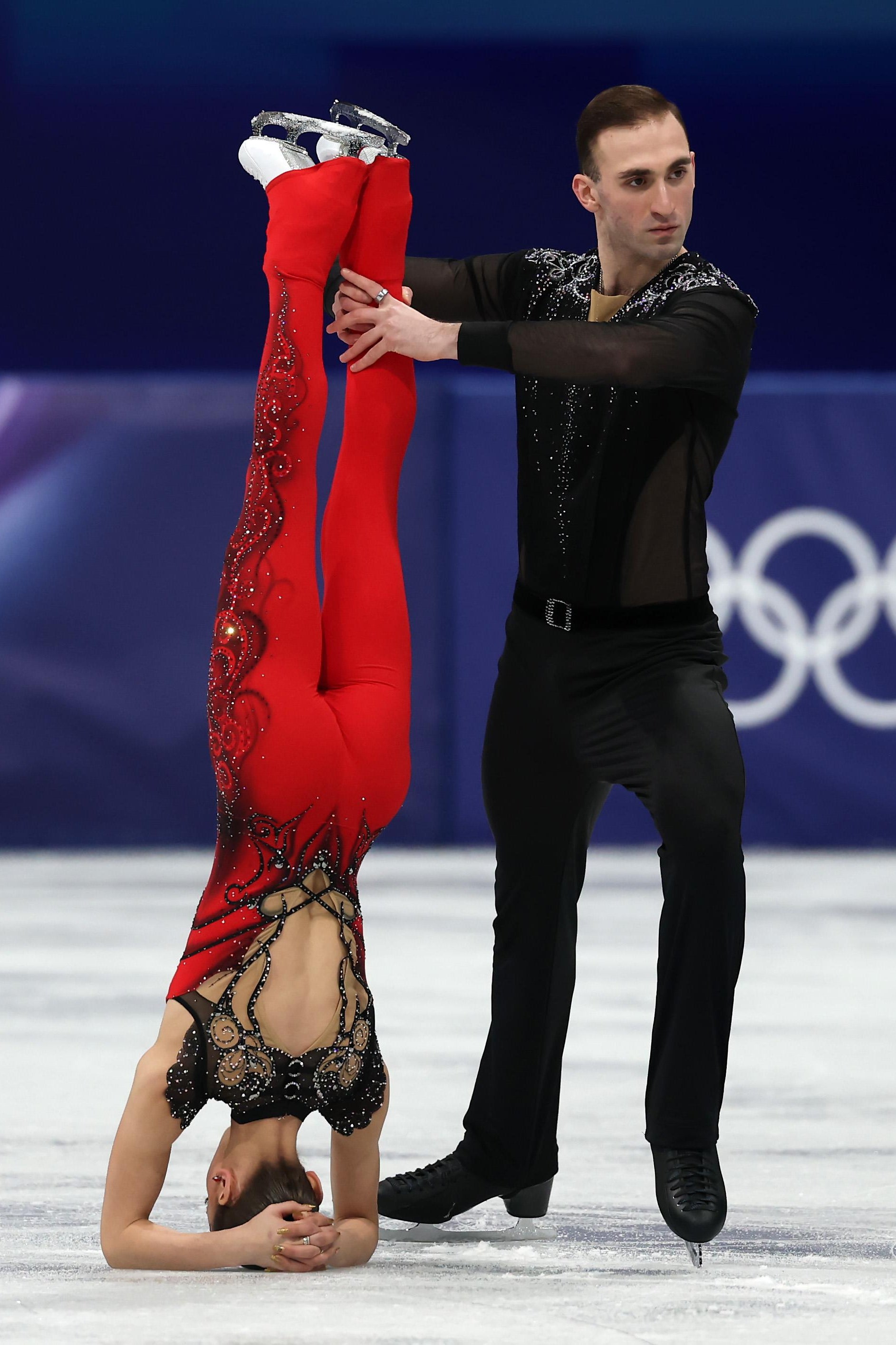 MILAN, ITALY - FEBRUARY 15: Anastasiia Metelkina and partner Luka Berulava of Team Georgia compete in Pair Skating - Short Program on day nine of the Milano Cortina 2026 Winter Olympic games at Milano Ice Skating Arena on February 15, 2026 in Milan, Italy. (Photo by Elsa/Getty Images)