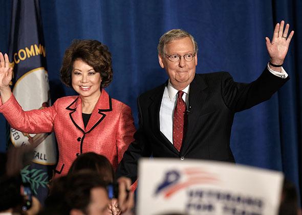 Mitch McConnell (R-KY) and his wife Elaine Chao arrive for a victory celebration following the early results of the state Republican primary.