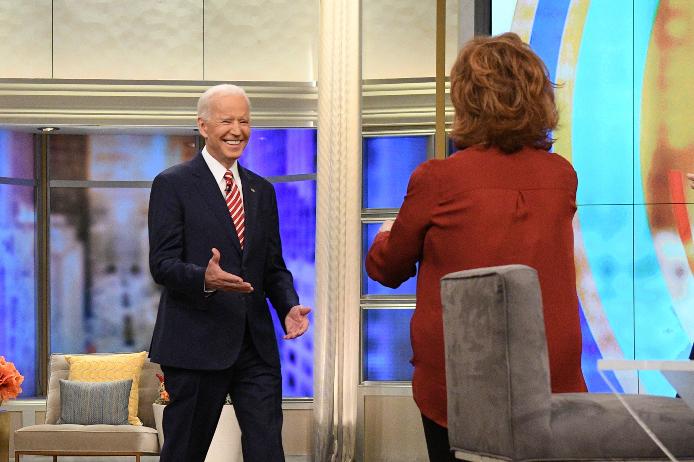 Joe Biden is greeted by Joy Behar as he walks on set on ABC's The View.