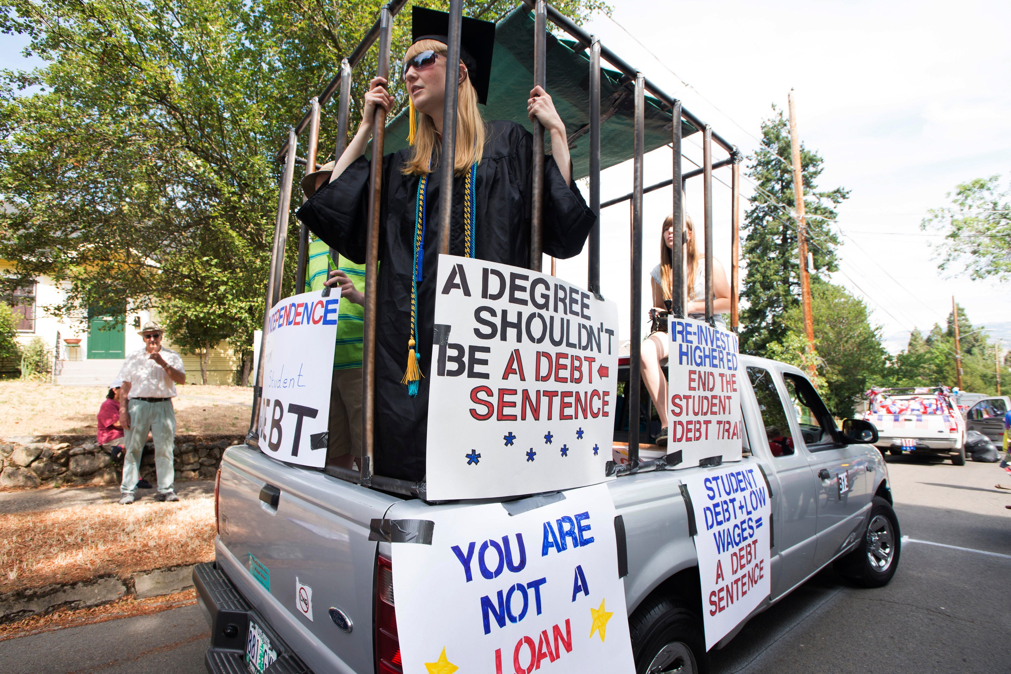 A demonstrator protests over student debt.