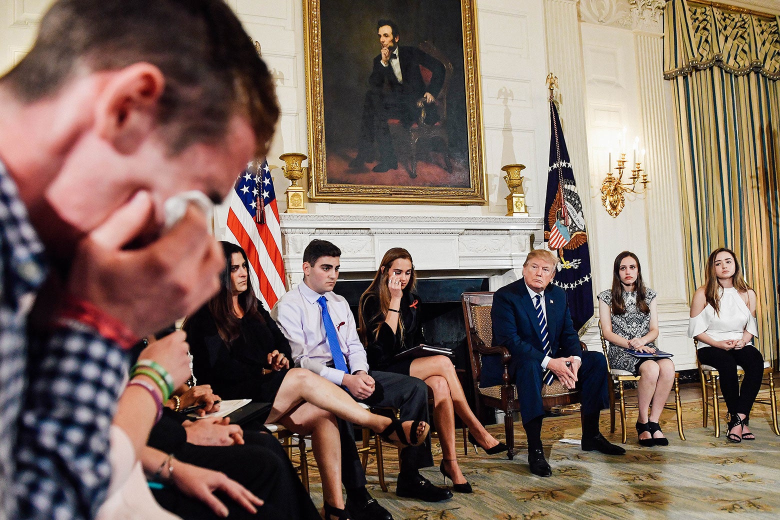 Samuel Zeif, a student at Marjory Stoneman Douglas High School, weeps after recounting his story of the shooting incident at his high school during a listening session with high school students and teachers at the White House on Wednesday in Washington.