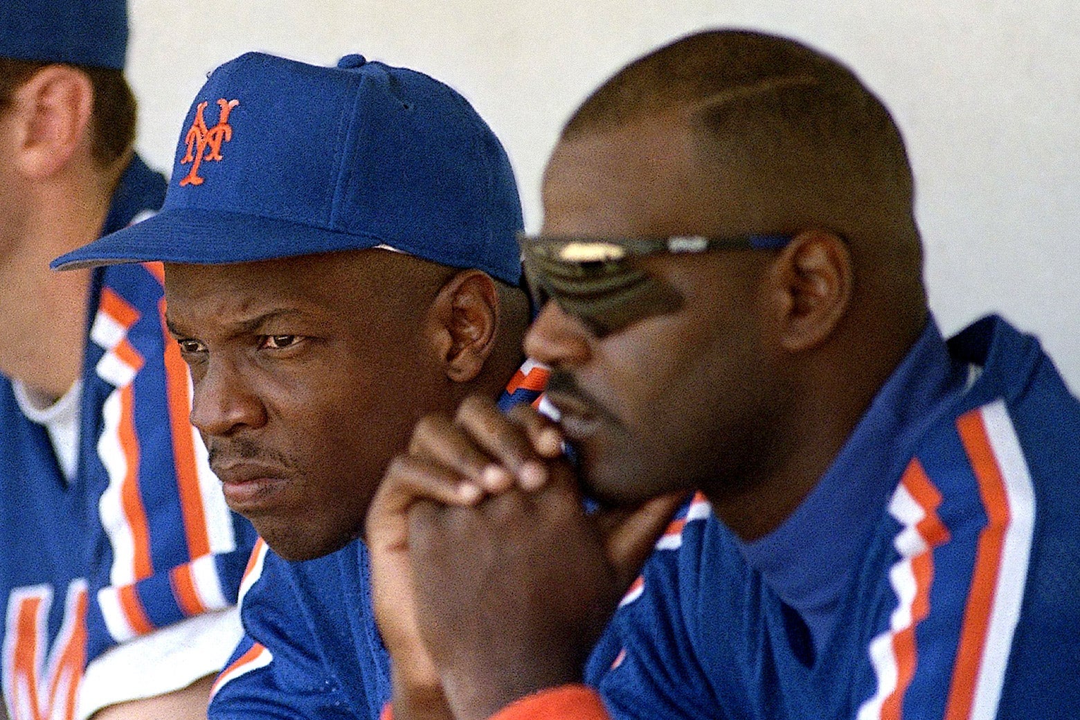 Dwight Gooden and Daryl Boston watch the game against the Atlanta Braves.
