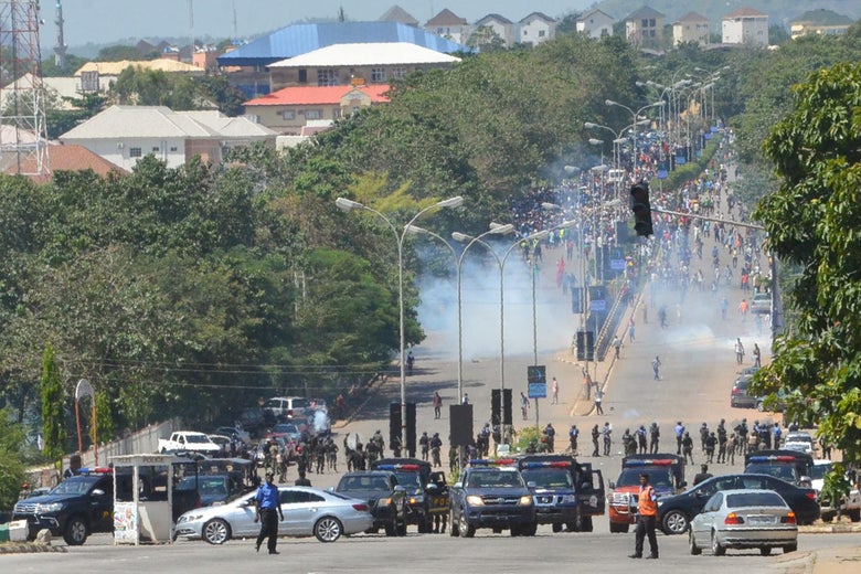 Police officers in Abuja firing teargas on protestors