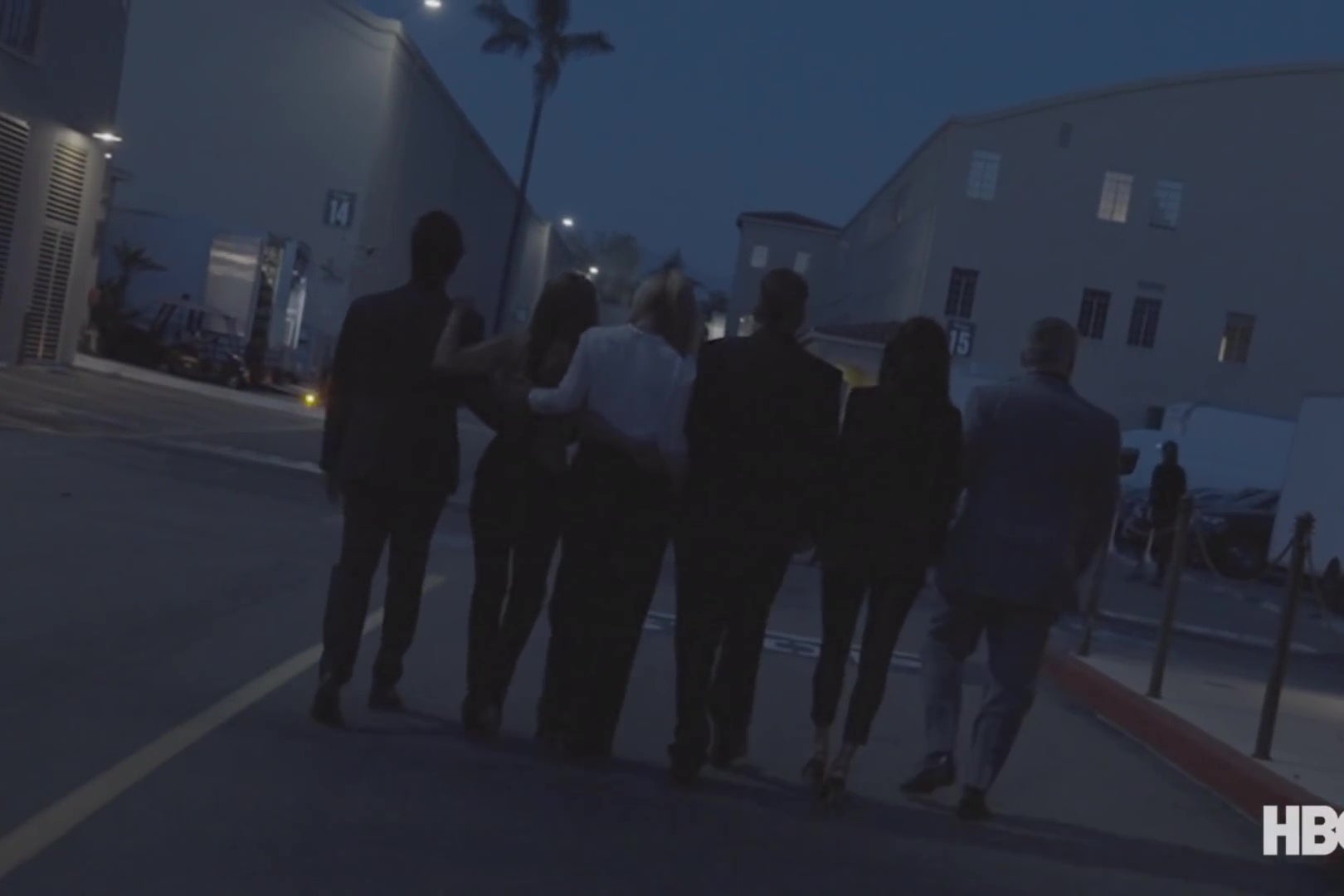 The cast of Friends walks away from the camera on the Warner Bros. backlot.