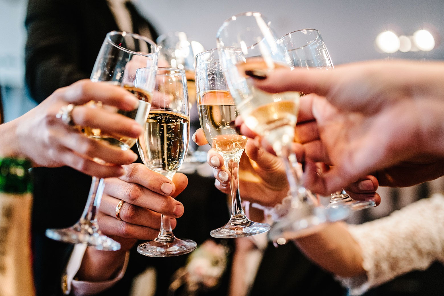 A bunch of champagne glasses clinking.