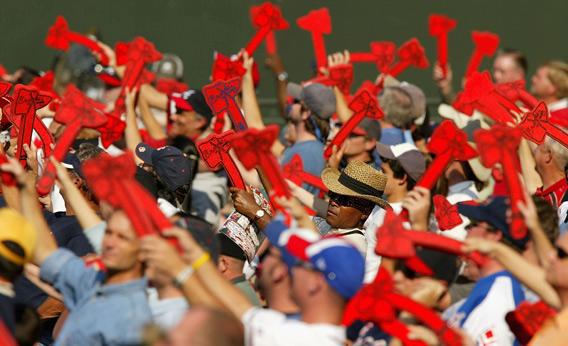 Fans of the Atlanta Braves do the Tomahawk Chop.