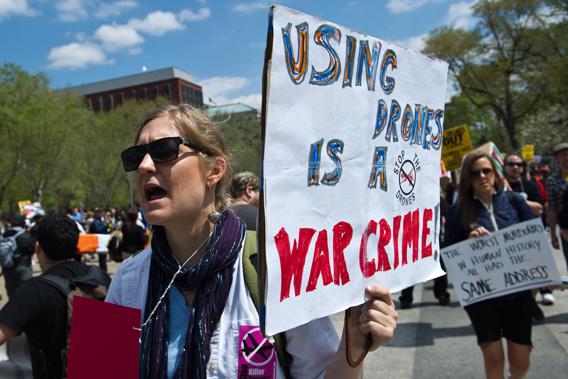 Protesters hold signs and chant slogans outside the White House in Washington on April 13, 2013 during a demonstration against the use of dones against Islamic militants and other perceived enemies of the US around the world.