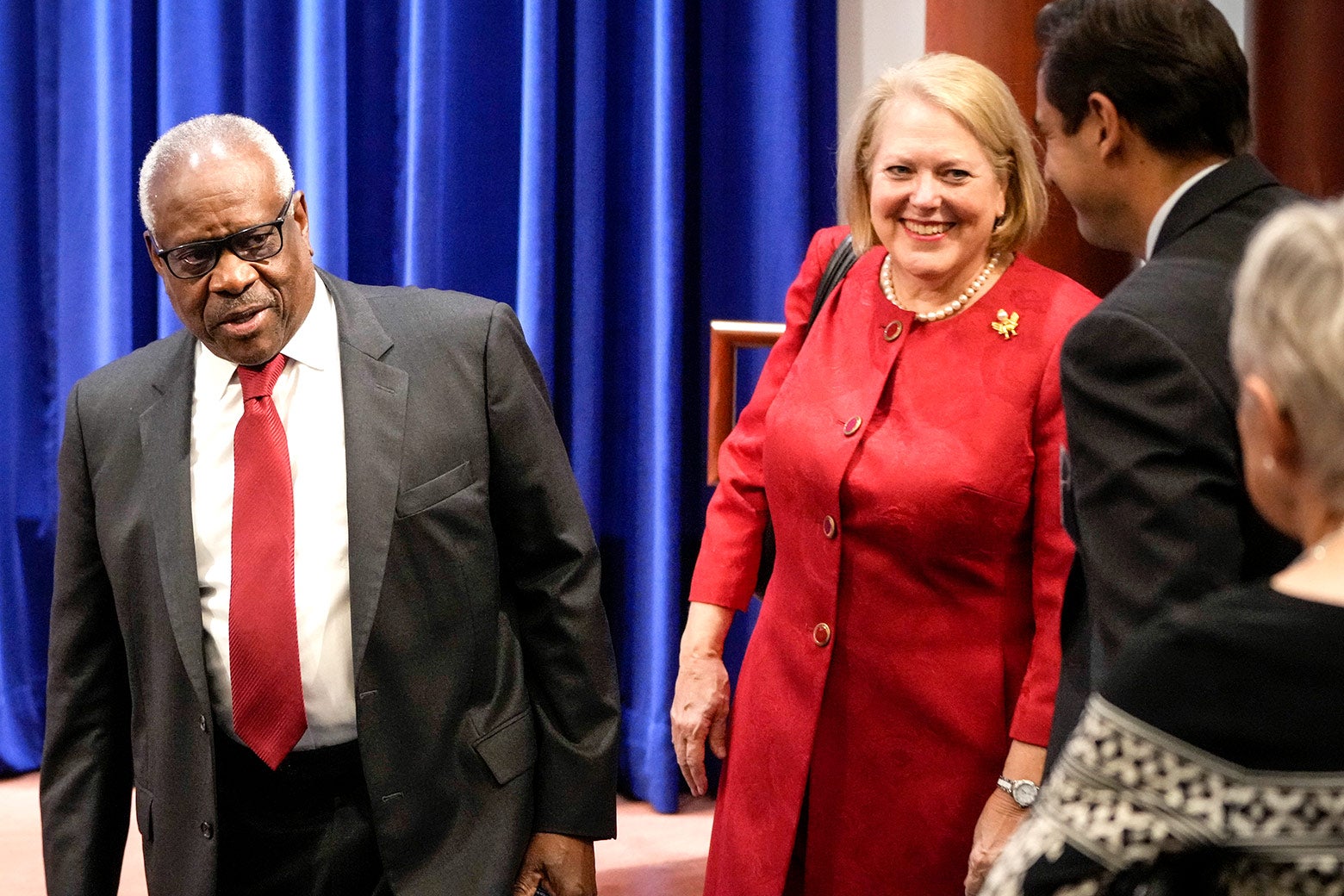 Clarence Thomas and Virginia Thomas arrive at a function.