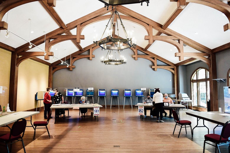 Voters cast their ballots at a polling place.