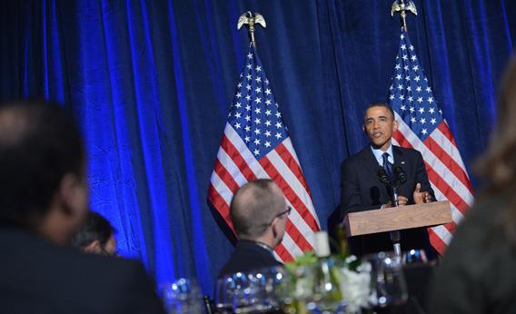 President Obama speaks during the Organizing for Action dinner.