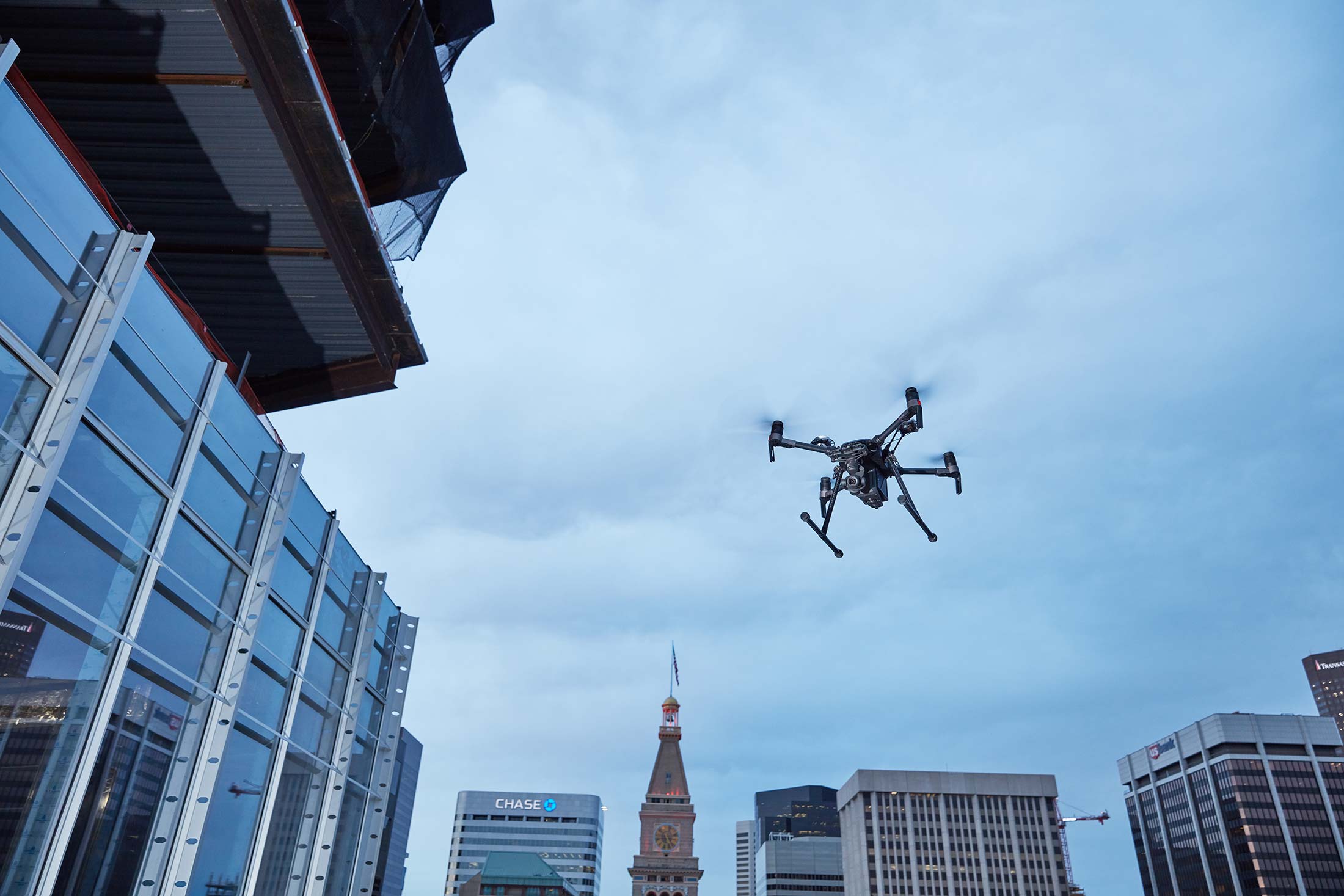 DJI's Matrice 200 drone flying over skyline.