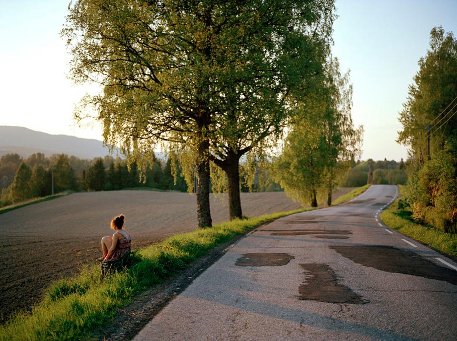 One Day in History"I like to sit here, because I feel that my dead friends are in the nature that surrounds us. So here they are close - even if they are gone."Aina Helgheim (19).PHOTO: ANDREA GJESTVANG/MOMENT www.andreagjestvang.com