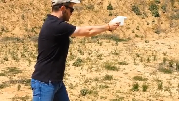 Cody Wilson fires his 3-D printed gun, dubbed "Liberator."