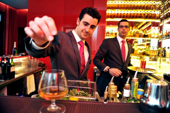 A barman works at the Hotel Radisson Blu in February 8, 2013 in Nantes, western France. 