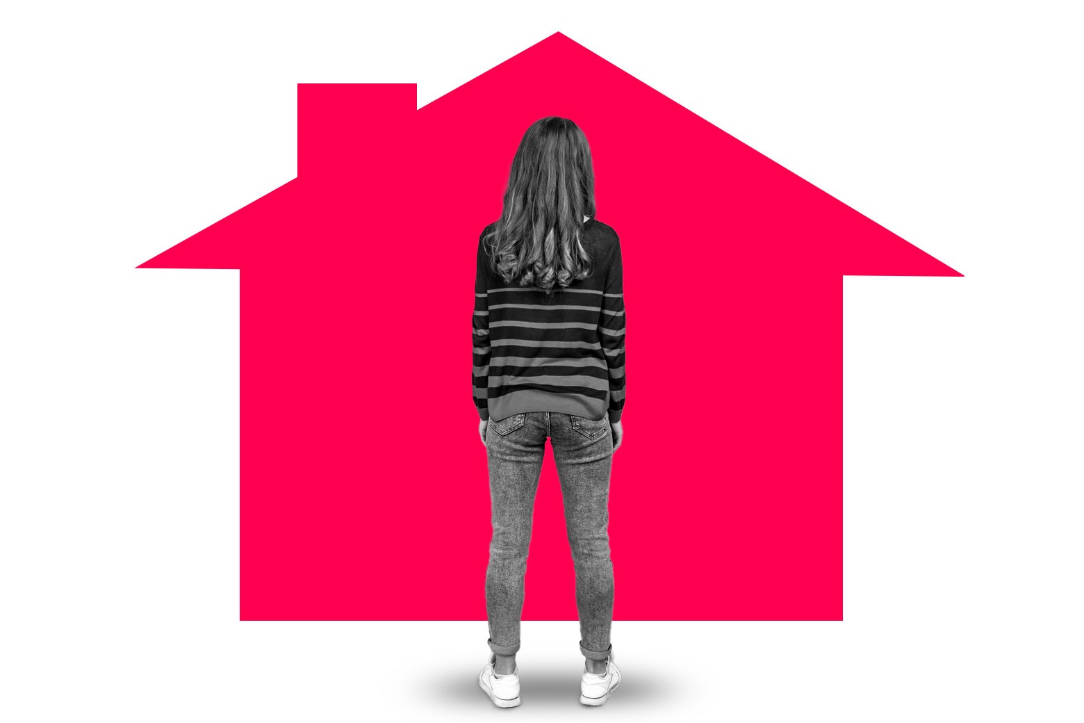 Woman standing in front of a house.