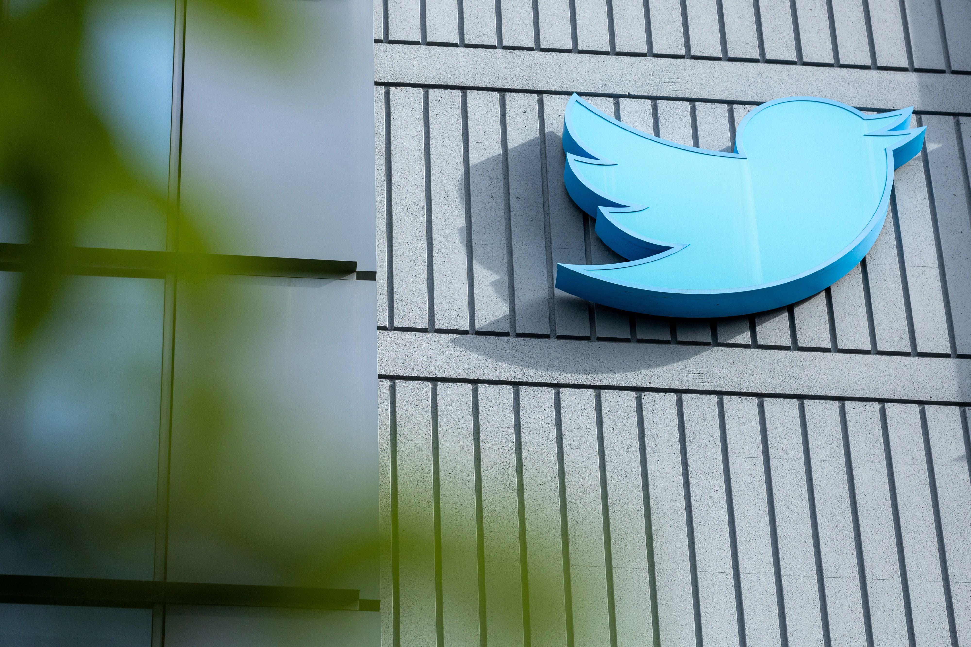 The Twitter logo is seen on a sign on the exterior of Twitter headquarters in San Francisco, California, on October 28, 2022. - After months of controversy, Elon Musk is now at the head of one of the most influential social networks on the planet, whose "tremendous potential" he has promised to unleash. (Photo by Constanza HEVIA / AFP) (Photo by CONSTANZA HEVIA/AFP via Getty Images)