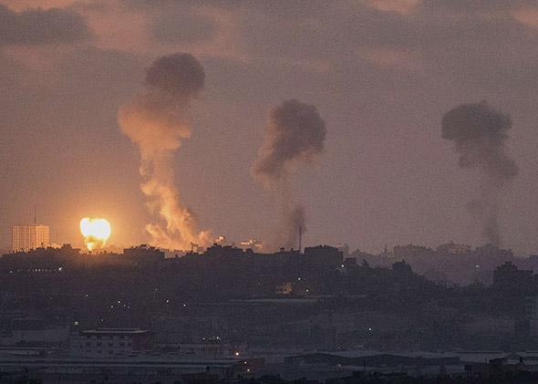 Israeli border with the Gaza Strip shows smoke billowing during an Israeli air strike in the Palestinian.