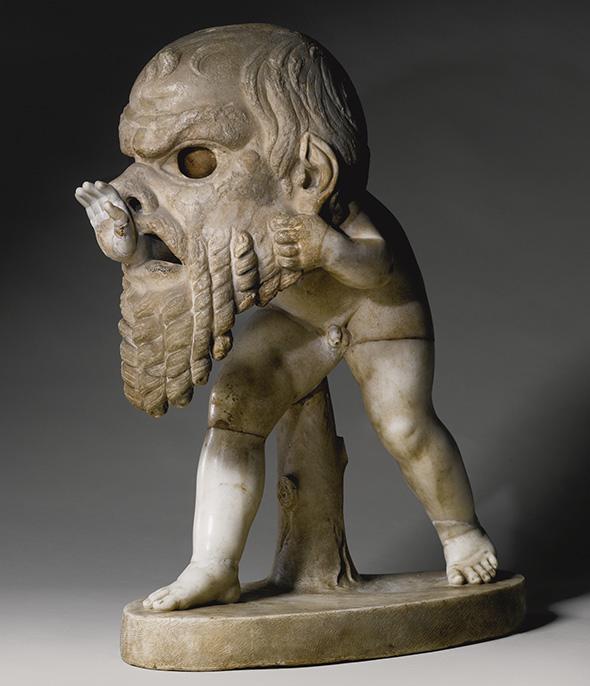 A Marble Figure of a Young Satyr wearing a Theater Mask of Silenus