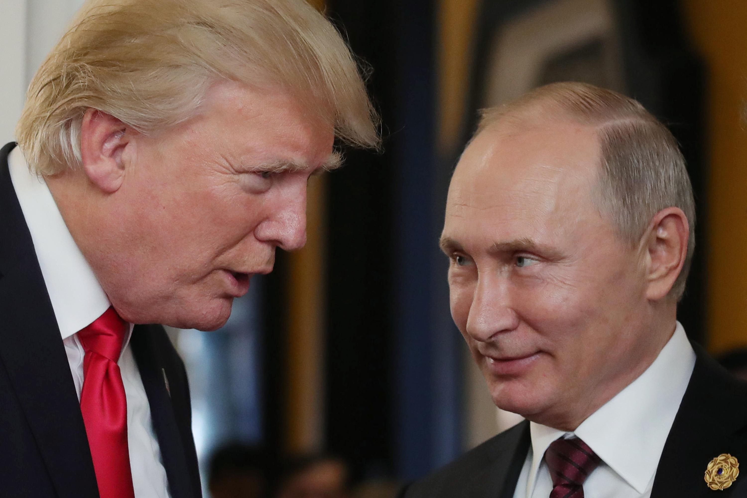 President Donald Trump chats with Russia’s President Vladimir Putin.