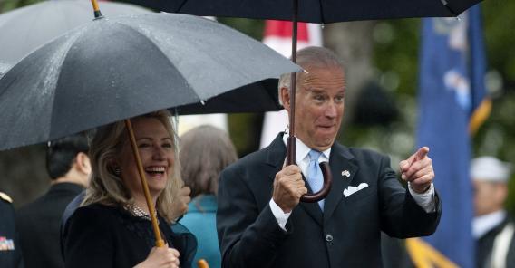 Vice President Joe Biden points to the crowd alongside Secretary of State Hillary Clinton as President Barack Obama welcomes South Korean President Lee Myung-bak during a State Arrival Ceremony on the South Lawn of the White House in Washington, D.C., on Oct. 13, 2011